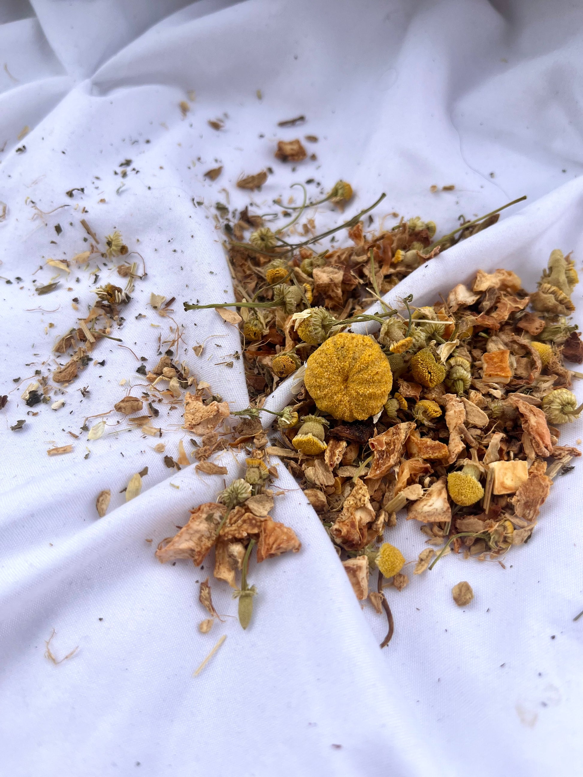 Herbal mix on a white fabric background